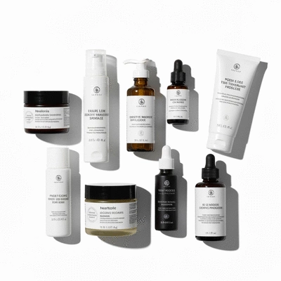 Various skincare products on a clean white background, focus on product labels and ingredients, no text, no words, no typography, clean image