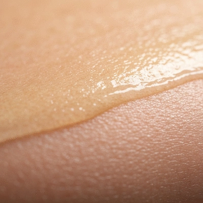 Close-up of healthy skin surface with a protective oily layer, symbolizing sebum's role in hydration and barrier function